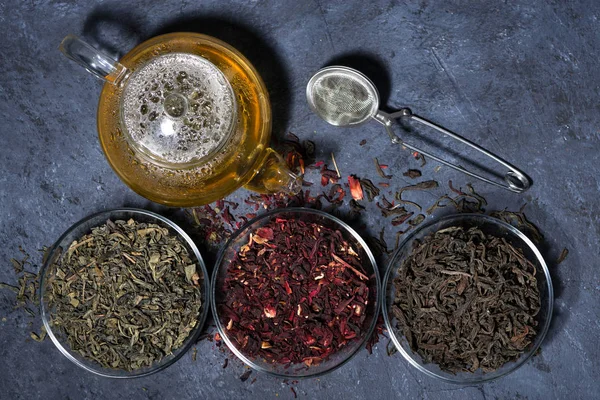 Assortment of dry tea on a dark background, horizontal — Stock Photo, Image