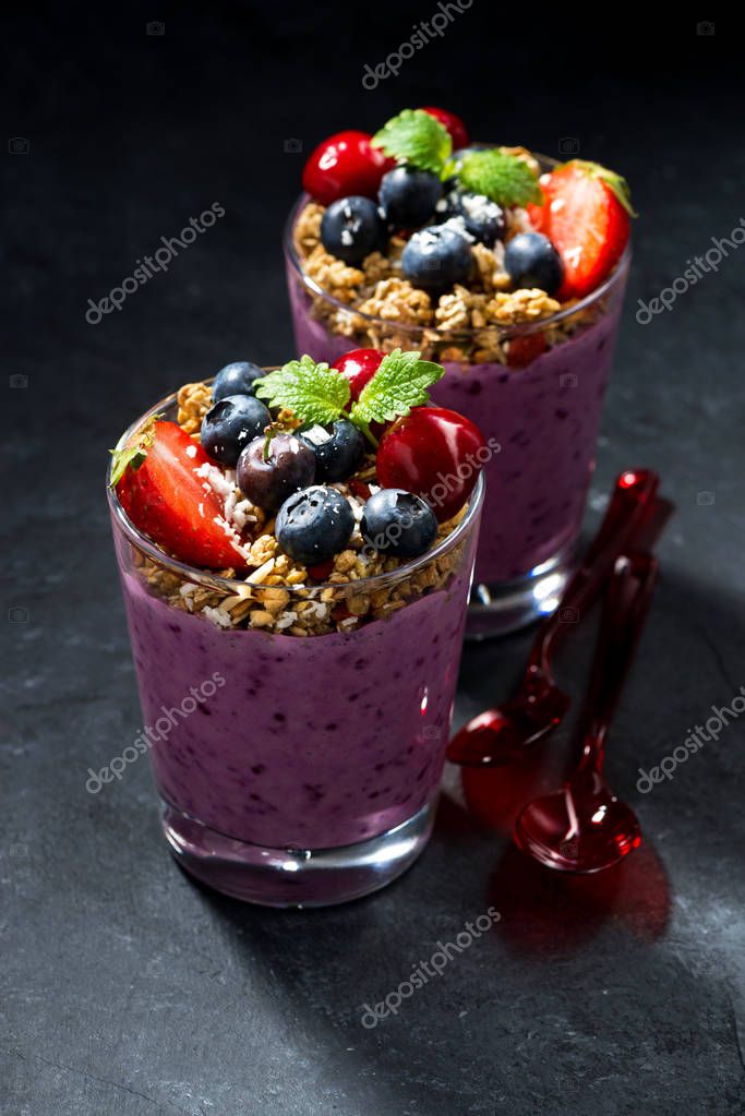 Healthy dessert with granola and berries on a dark background — Stock