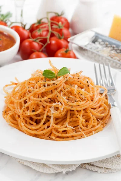 Pasta with tomato sauce and ingredients, vertical, closeup — Stock Photo, Image