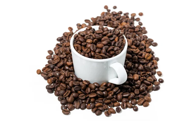 Cup with coffee beans on white background — Stock Photo, Image