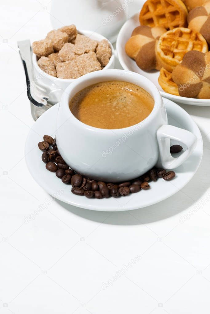 cup of coffee with sweets for dessert on white background