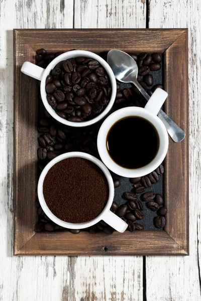 Three types of coffee - ground, grain and beverage