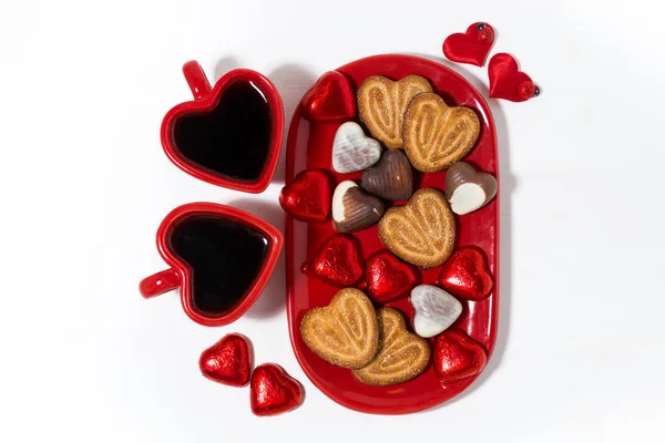Plate with cookies and candies for St. Valentines Day and coffee — Stock Photo, Image
