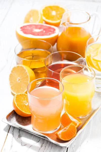 Assortment of fresh citrus juices, vertical — Stock Photo, Image