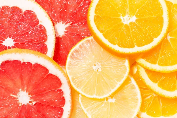 Assortment of fresh citrus slices, top view — Stock Photo, Image