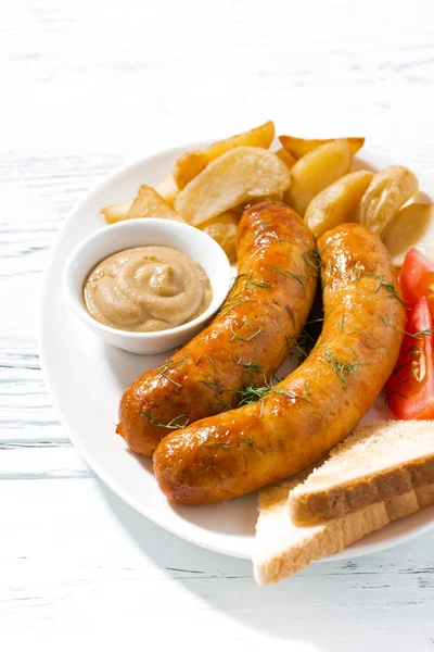 Fried pork sausages with potatoes and mustard — Stock Photo, Image