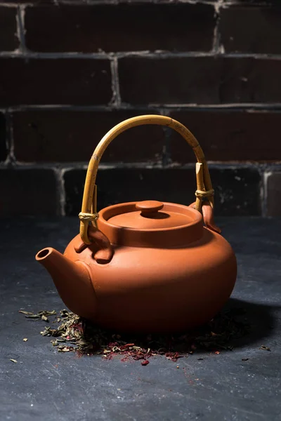 Brown ceramic teapot on a dark background, vertical — Stock Photo, Image