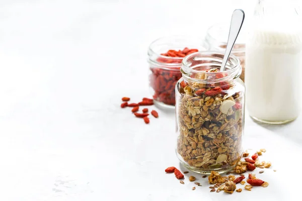 Healthy granola with goji berries in and white background — Stock Photo, Image