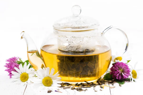 Fragrant herbal tea in a teapot on white wooden background — Stock Photo, Image