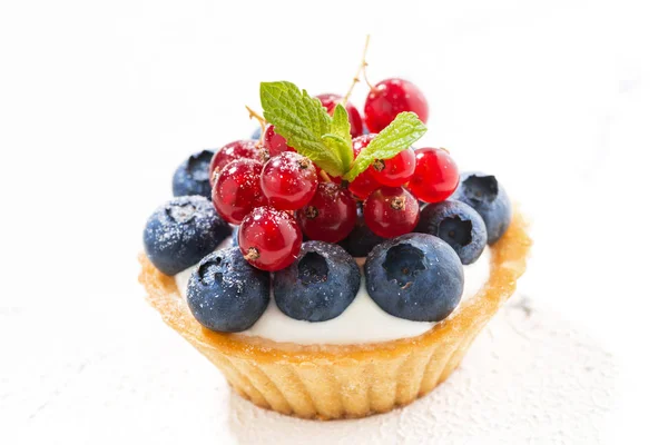 Mini tart with cream and berries on white background — Stock Photo, Image