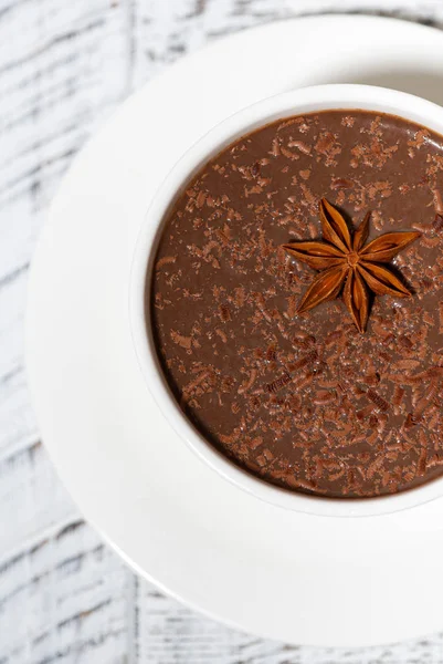 Cup of hot spiced chocolate on white background, vertical — Stock Photo, Image