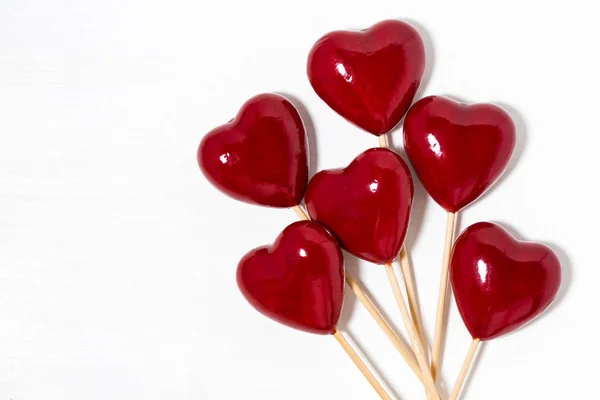 Decorative hearts on sticks on a white background, top view — Stock Photo, Image