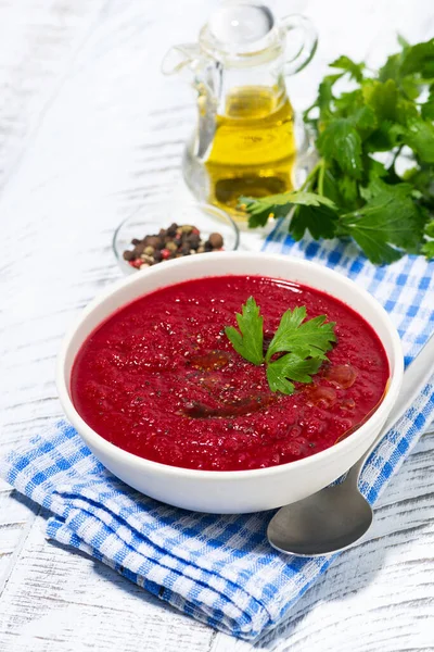 Cold beet soup in a bowl on white background, vertical — Stock Photo, Image