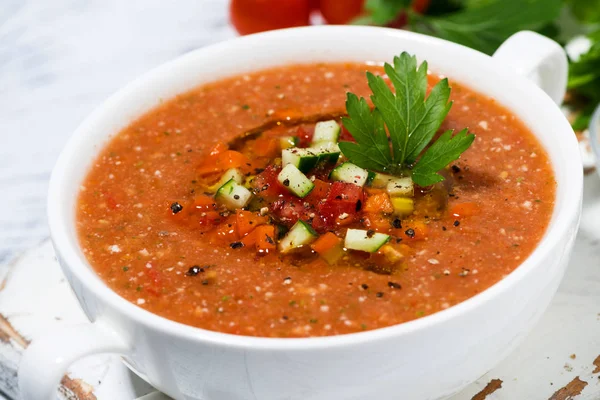 Cold tomato soup in a bowl on white background, closeup — Stock Photo, Image