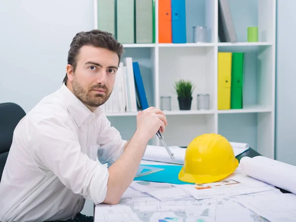 Architect working on his projects papers in the office — Stock Photo, Image