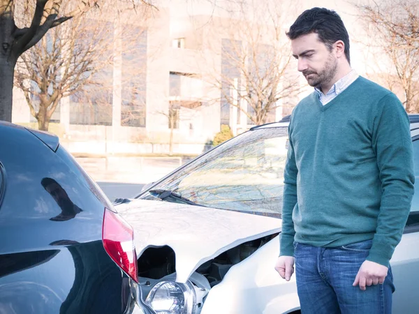 Upset man after a car crash accident