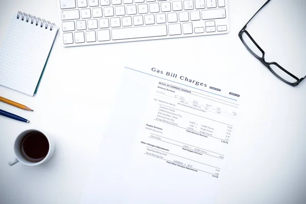 White desk with bills to pay — Stock Photo, Image