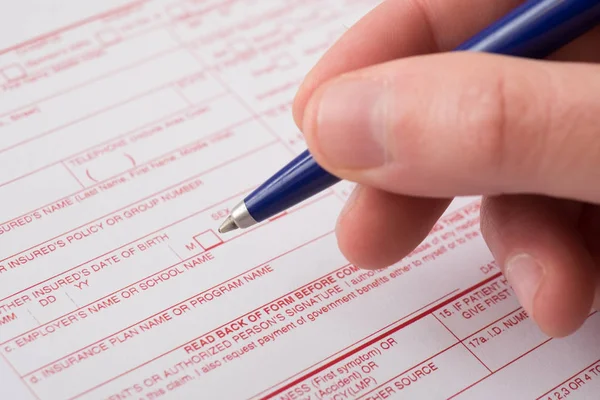 Health insurance claim form and pen — Stock Photo, Image