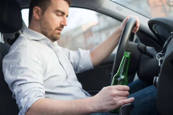 Drunk man driving car and falling asleep — Stock Photo, Image