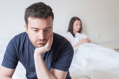 Sad and thoughtful man after arguing with girlfriend  clipart