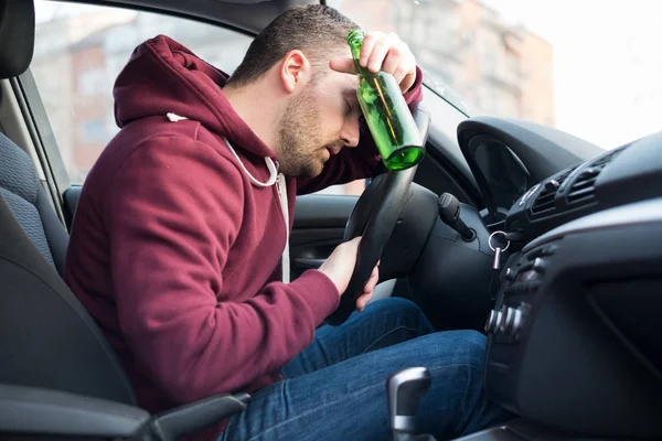 Drunk man driving car and falling asleep — Stock Photo, Image