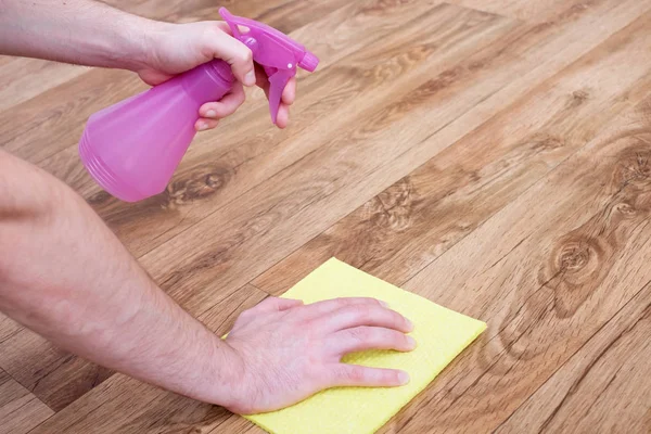 A hand of man leaning a parquet floor — Stock Photo, Image