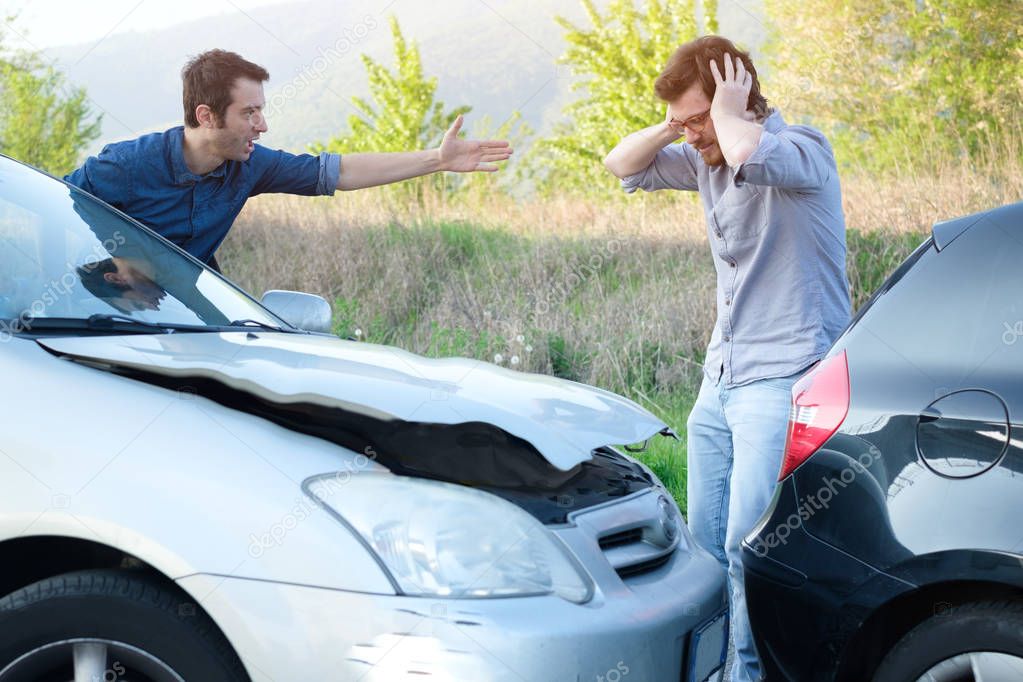 Two angry men arguing after a car crash