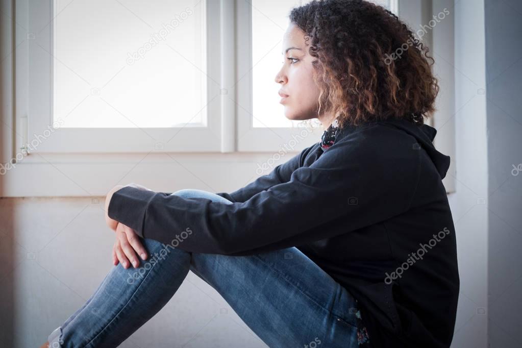 Alone and lonely young girl feeling depressed