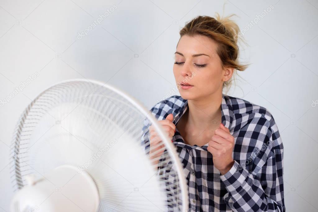 Girl trying to refresh from the summer heat haze
