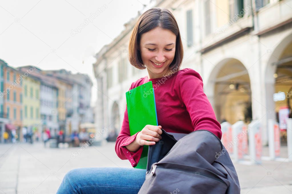 Young student girl on urban city background