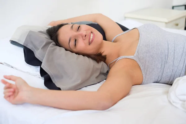 Cheerful woman stretching arms in the morning — Stock Photo, Image