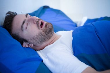 Face close up of snoring man because of hypopnea disorder clipart