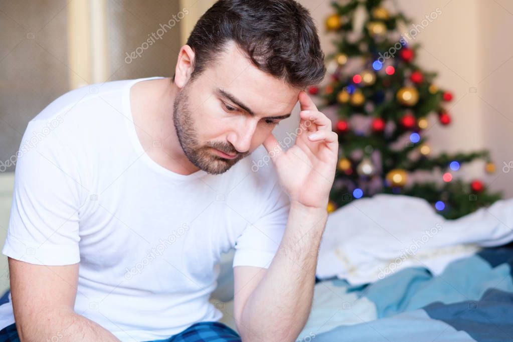 Portrait of man feeling negative emotions during holidays celebr