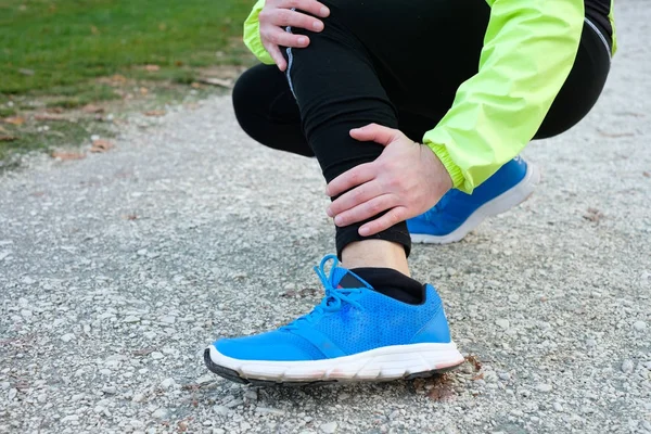 Ankle injury and man runner exercising with leg pain — Stock Photo, Image
