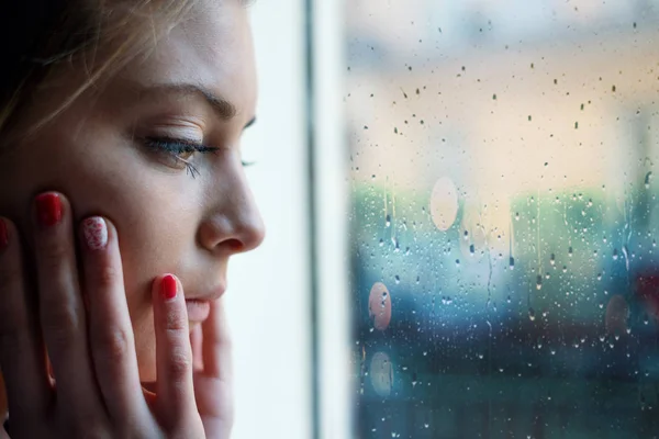 Face close up portrait of young girl next to window glass — Stock Photo, Image