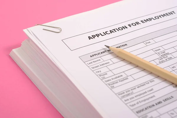 Pile of cv on pink background as equal opportunities concept — Stock Photo, Image