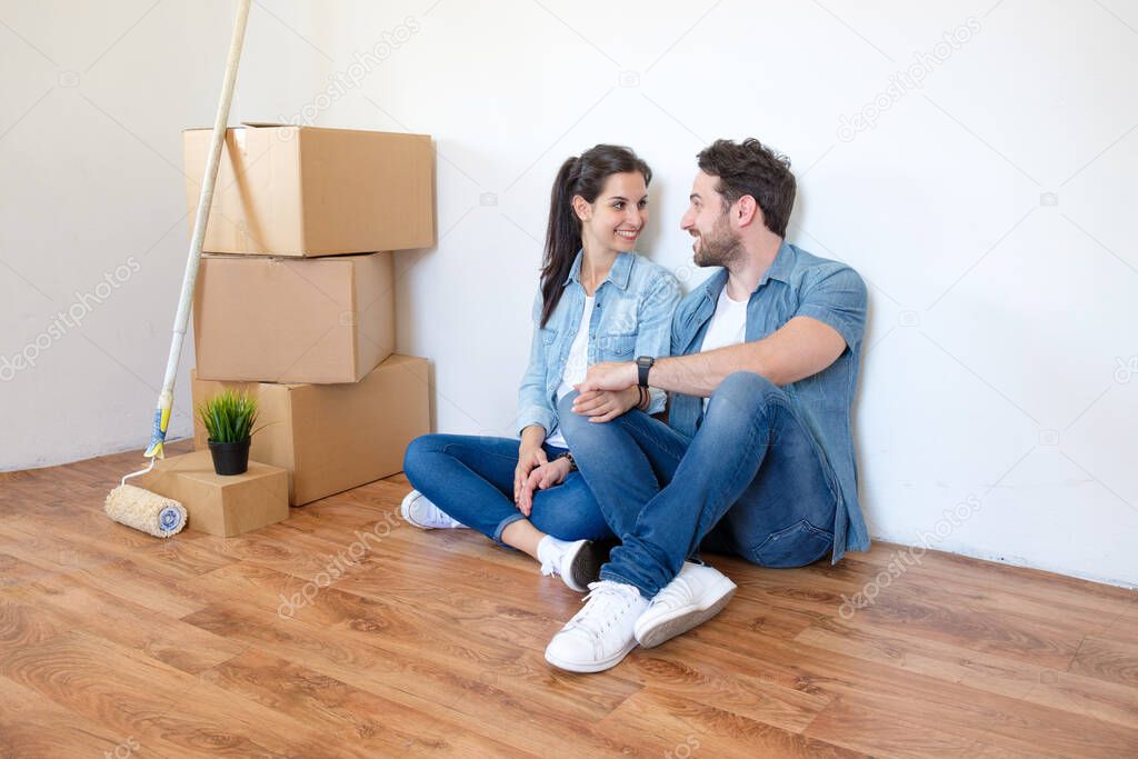Excited young couple looking forward to moving into a new home