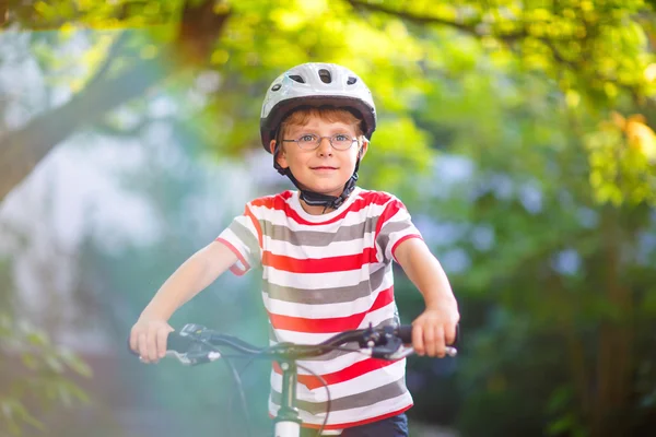 Preschool kid boy in helmet having fun with riding of bicycle — Stock Photo, Image