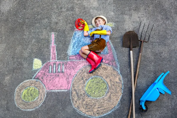 Little kid boy having fun with tractor chalks picture — Stock Photo, Image