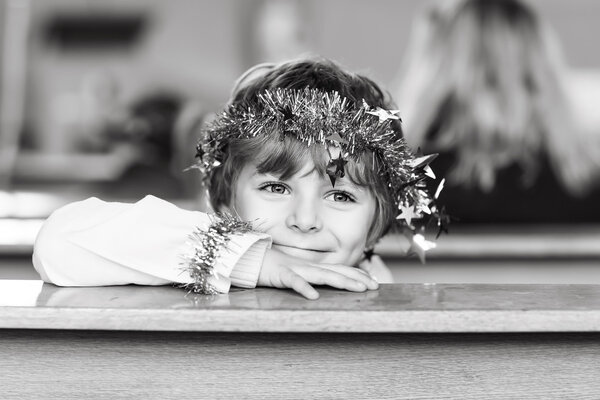 little kid boy in church on Christmas eve