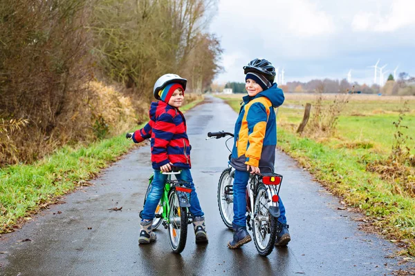 Little preschool kids boys riding on bicycle — Stock Photo, Image