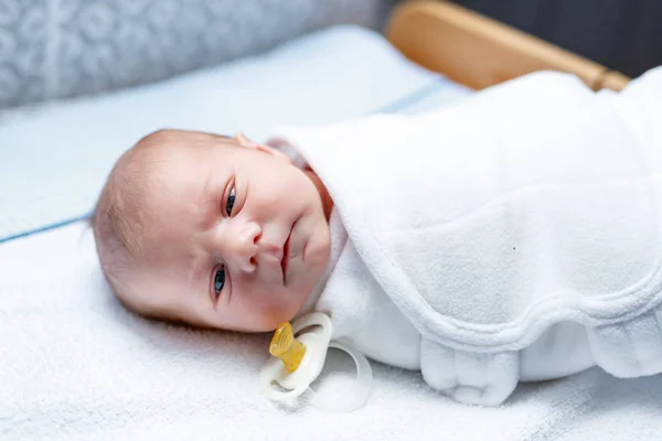Portrait of cute adorable newborn baby on changing table — Stock Photo, Image