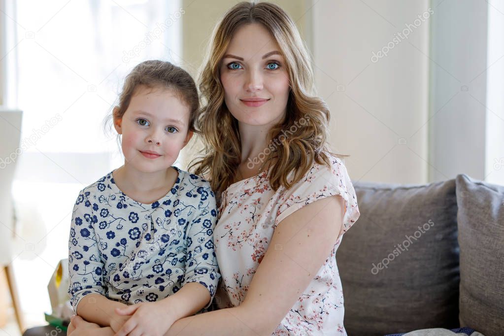 Portrait of beautiful mother and little cute daughter
