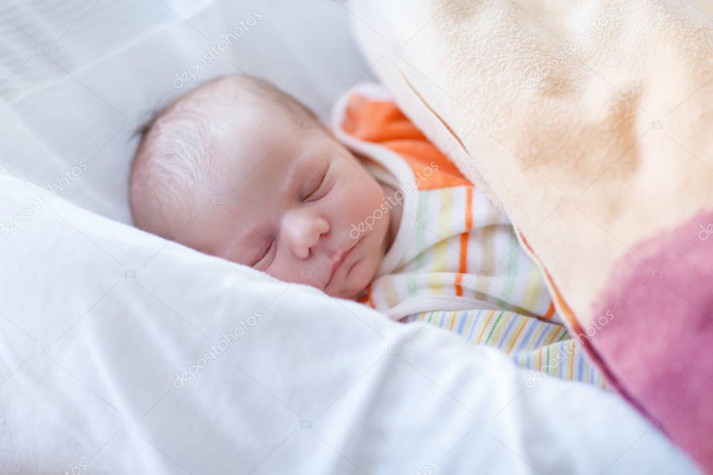Portrait of cute adorable newborn baby girl sleeping