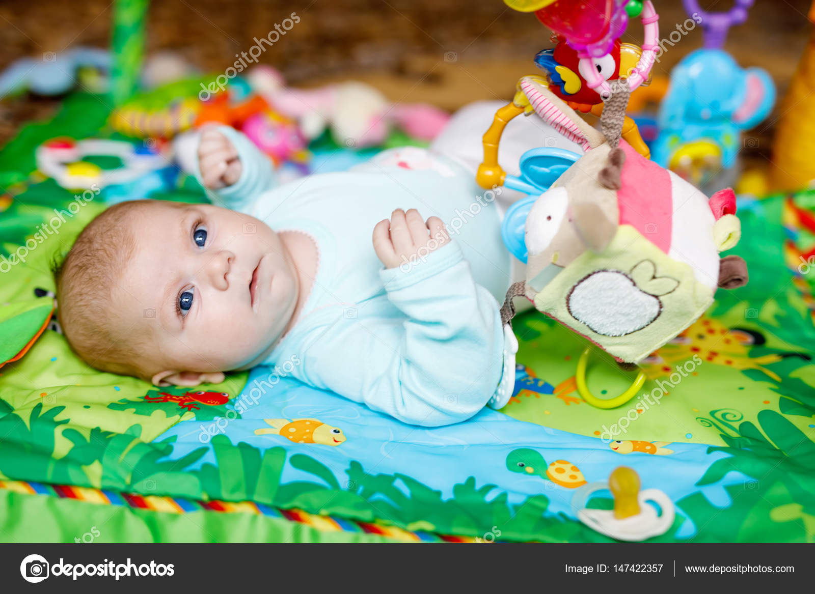 newborn baby playing toys