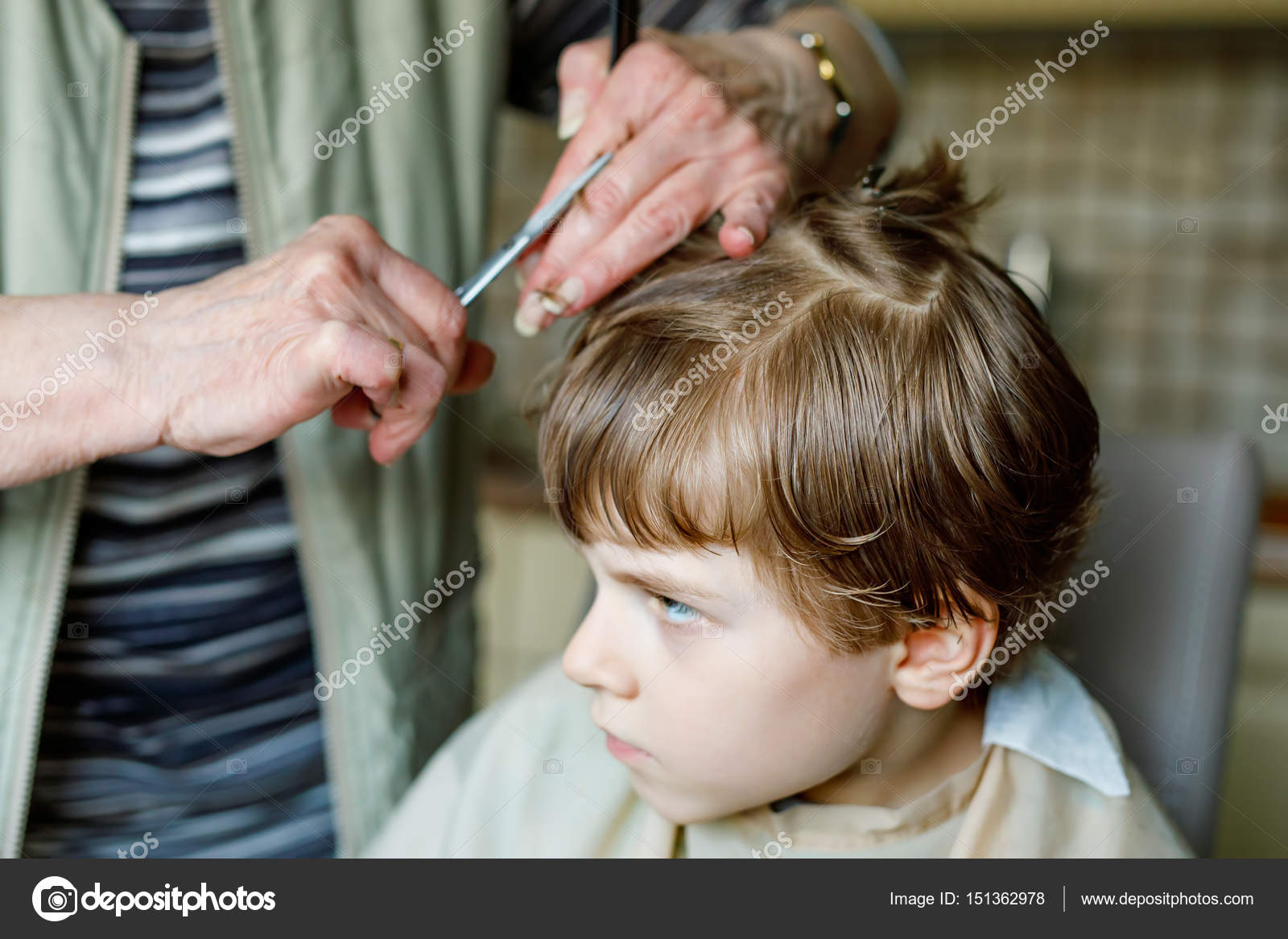Beautiful kid boy with blond hairs getting his first haircut. Stock Photo by ©romrodinka 151362978 Beautiful kid boy with blond hairs getting his first haircut. Stock Photo by ©romrodinka 151362978