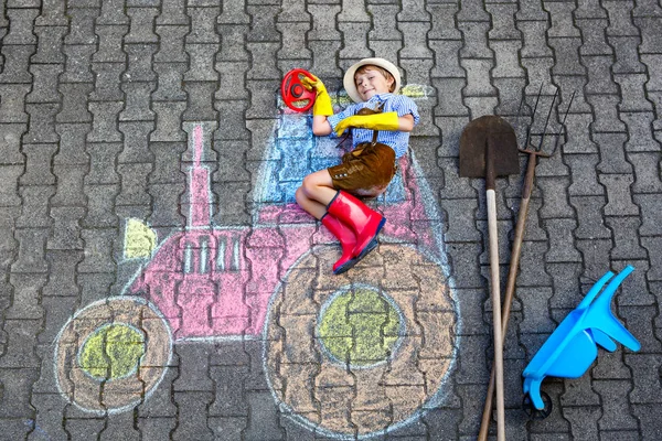 Little kid boy having fun with tractor chalks picture — Stock Photo, Image