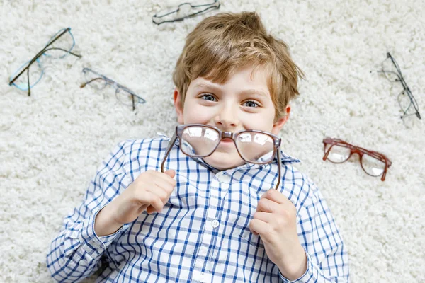 Close-up portrait of little blond kid boy with brown eyeglasses — Stock Photo, Image