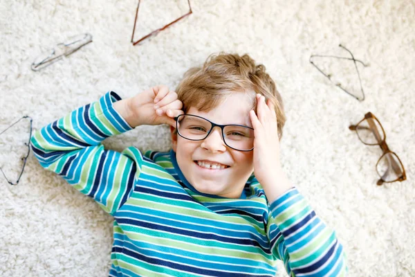 Close-up portrait of little blond kid boy with brown eyeglasses — Stock Photo, Image