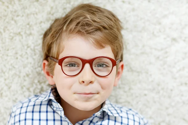 Close-up portrait of little blond kid boy with brown eyeglasses — Stock Photo, Image